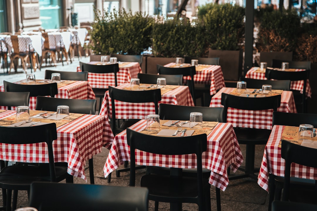 a restaurant with red and white checkered tablecloths